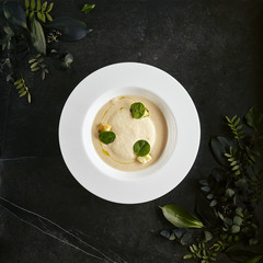 Exquisite Serving White Restaurant Plate of Cream Cappuccino Soup with Porcini Mushrooms and...