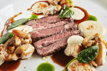 Restaurant Plate of Black Angus Beef Fillet with Warm Potatoes in Cheese Sauce and Mushroom Espuma