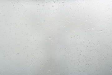 wet glass background condensate / abstract rain, drops texture on transparent glass