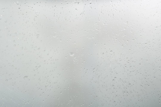wet glass background condensate / abstract rain, drops texture on transparent glass