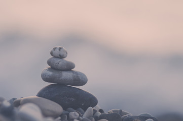 stack of zen stones on pebble beach