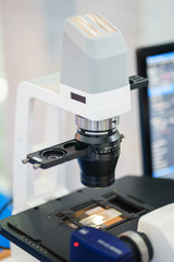 Close up modern medical instrument microscope for the study of biological samples.