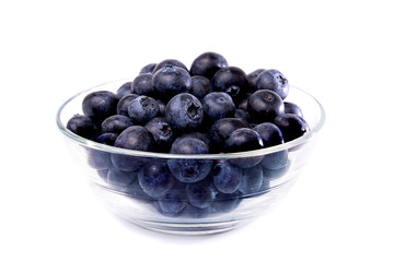 A glass bowl of blueberries isolated on white background