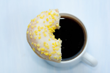 Coffe cup and donut.