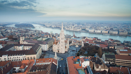 Aerial skyline view of Matthias Church with Danube River and Parliament. Beautiful sunny day at Budapest, Hungary, Europe.