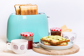 cyan color toaster on a wooden background