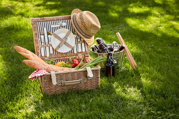 Vintage style summer picnic in a wicker basket