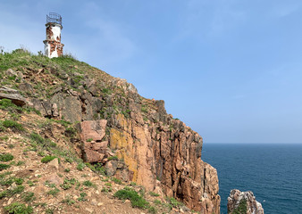 Russia, Vladivostok, Island of Shkot in cloudy weather. Cape  Mayachny. Old lighthouse