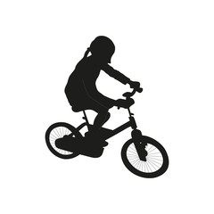 Obraz premium Isolated icon of blak silhouette of child girl on bicycle on white background.