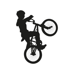 Isolated icon of blak silhouette of child boy on bicycle on white background.