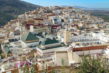 View from a terrace on the holy pilgrim town of Moulay Idriss with mausoleum of Moulay I, Meknes, Morocco, Africa
