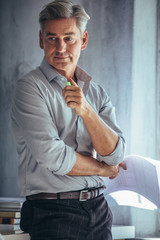 Thoughtful mature businessman at office