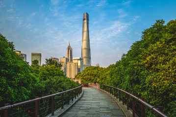 skyline of shanghai city and a wooden pathway