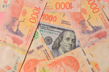 New Argentine banknotes and US dollar bills