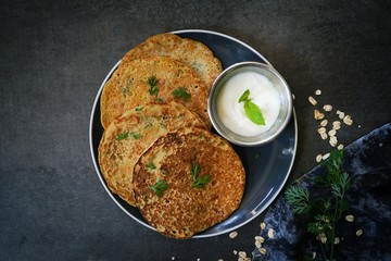 Savory Oats Semolina pancakes or Dosa / Healthy breakfast concept,top view