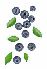 Blueberries with green leaves closeup, isolated on white background