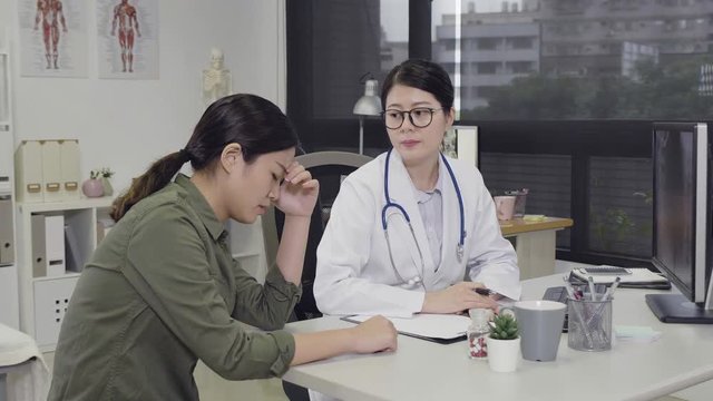 slow motion psychiatrist listening to patient talking about her situation. sick illness woman coming to clinic office explaining symptoms to doctor. medical staff concentrated on lady in hospital