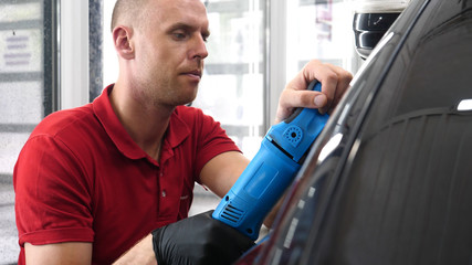 A professional bodywork and headlamp polishing worker will transport the car after painting or...