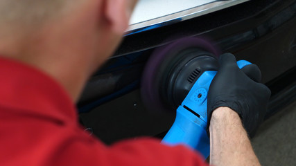 A professional bodywork and headlamp polishing worker will transport the car after painting or...