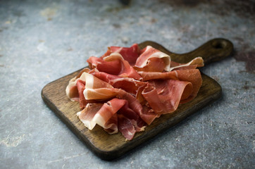 Prosciutto di Parma on cutting board