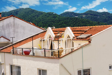 View of Marmaris from above, the roofs of houses from the tiles and the mountains. Turkey