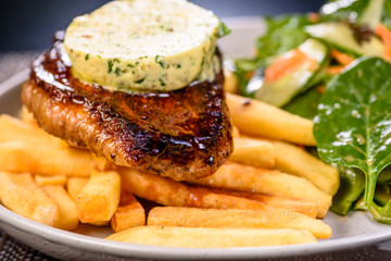 Traditional pub meal, steak and chips with salad.