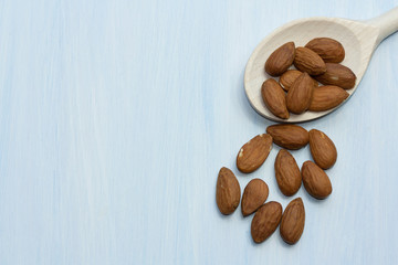 almonds in wooden spoon