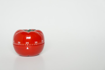 Close up view of mechanical tomato shaped kitchen clock timer for cooking & studying. Used for...