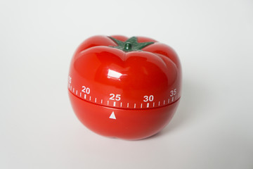 Close up view of mechanical tomato shaped kitchen clock timer for cooking & studying. Used for...
