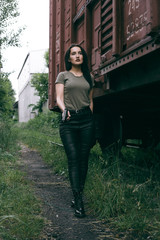 Powerful Woman Holding Gun Action Movie Style. Train adventure. Military girl with .