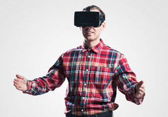 Guy in mask experiencing virtual reality as new entertainment device