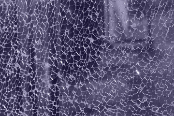 Blurred shot of broken glass. Broken window background. Abstract textures background.