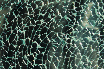 Blurred shot of broken glass. Broken window background. Abstract textures background.