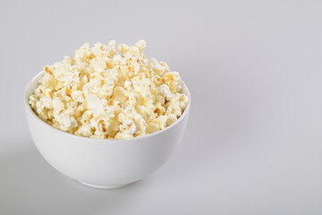 Isolated Caramel popcorn in white bowl.
