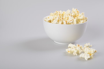 Bowl of popcorn isolated on white background.
