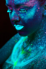 UV painting of a universe on a female body portrait