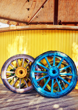 Stack of colorful decorative retro wooden wheels 