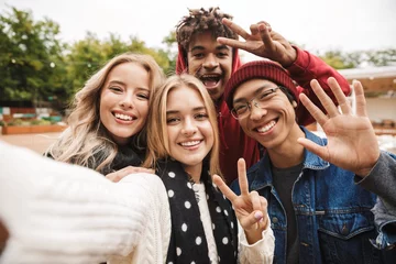 Fotobehang Group if cheerful multiethnic friends teenagers © Drobot Dean