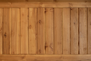 The style of bringing wooden plates together into a wooden wall with brown color.