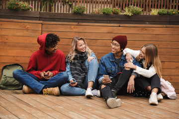 Group if cheerful multiethnic friends teenagers