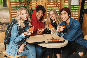 Happy multhietnic friends hanging out together