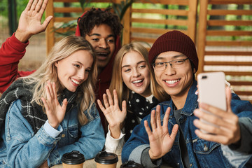 Group if cheerful multiethnic friends teenagers