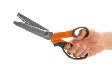 Woman holding scissors on white background, closeup