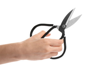 Woman holding scissors on white background, closeup