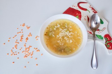 Tasty vegan lentil soup bowl with spoon