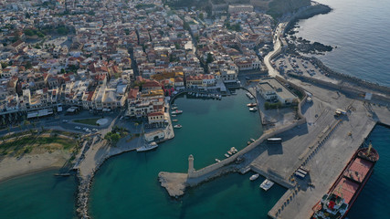 Obraz premium Aerial drone photo of unique old picturesque Venetian port with old lighthouse in the heart of famous city of Rethymno, Crete island, Greece