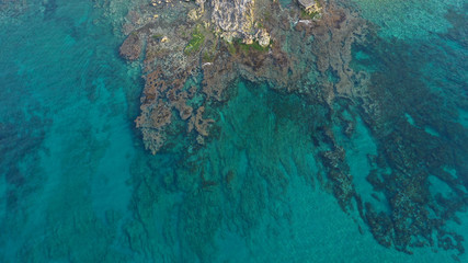 Fototapeta premium Aerial drone photo of unique old picturesque Venetian port with old lighthouse in the heart of famous city of Rethymno, Crete island, Greece
