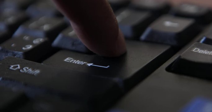 Finger presses computer keyboard key
