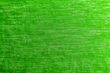 A uniformly lit green fabric texture with soft shadows.