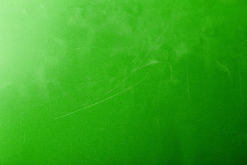 Bright abstract dirty green texture with scratches and scuffs